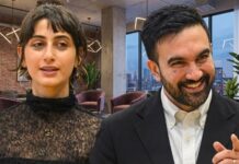 MAMDANI Tax Day THREAT — Families Flee Overnight… Two professionals engaged in conversation in a modern office setting