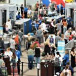 JUST IN: Ebola Hits Atlanta – Major Airport ALERT…… Crowd at an airport security checkpoint with TSA officers.