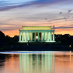 Lincoln Memorial SEIZED — Trump’s Pool Guy Cashing In… Lincoln Memorial illuminated at sunset with reflection in water