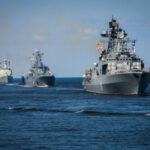 Cuba BLASTS Invasion Alarms—But Where’s The War? Several naval warships sailing in the ocean.
