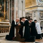 VATICAN Bombshell: Trump Won’t Like This… Clergy members kneeling in prayer inside a grand cathedral
