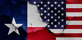 A weathered depiction of the Texas and American flags side by side