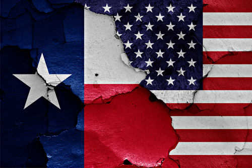 Flags,Of,Texas,And,Usa,Painted,On,Cracked,Wall A weathered depiction of the Texas and American flags side by side
