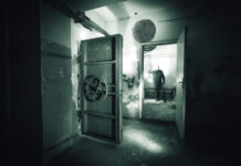 DOOMSDAY Dream Turns Lawsuit Nightmare… A dark, abandoned room with a mysterious figure in the background