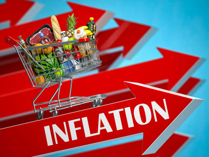 1976190356 Shopping cart filled with groceries atop Inflation arrow.