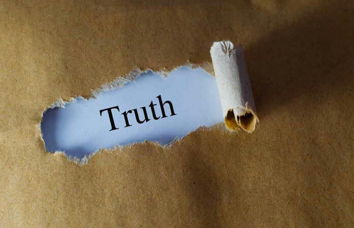 384729706-1 Torn paper revealing the word Truth