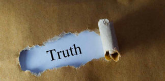 Torn paper revealing the word Truth