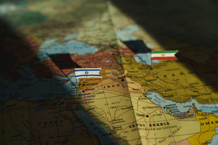 shutterstock2533443217jpg Map of the Middle East with small flags marking Israel and Iran