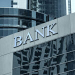 BOMB-STRAPPED Standoff Paralyzes California BANK Bank building facade with large sign and glass windows