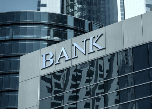 shutterstock574713295jpg Bank building facade with large sign and glass windows