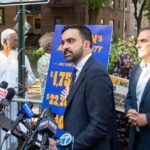 Rent Freeze Backfires? NYC’s Costly Twist Person handing over house keys to another.