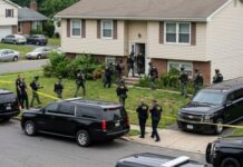 Dawn GUNFIRE — Kids Hit, Shooter Vanishes Law enforcement officers conducting a raid in a residential neighborhood