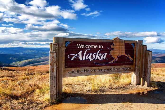 Alaska,Welcome,Sign Welcome to Alaska sign in a mountainous landscape