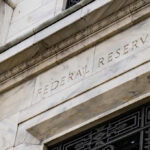 Warsh Stuns Senate, Stakes His Ground Building with Federal Reserve inscription in stone facade.