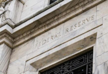Warsh Stuns Senate, Stakes His Ground Building with Federal Reserve inscription in stone facade.
