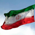 Tel Aviv’s Bet on Pahlavi — Dangerous Gamble? Iranian flag flying against a clear sky.