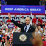Johnson’s Nuke-The-Rule Gambit Explodes Politician speaking at rally with Keep America Great! sign.