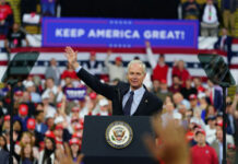 Johnson’s Nuke-The-Rule Gambit Explodes Politician speaking at rally with Keep America Great! sign.