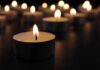 Ohio River Tragedy Raises Alarming Questions Tealight candle burning with soft glow