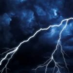 Lightning Misses Mom by Inches Lightning bolts streak across dark storm clouds