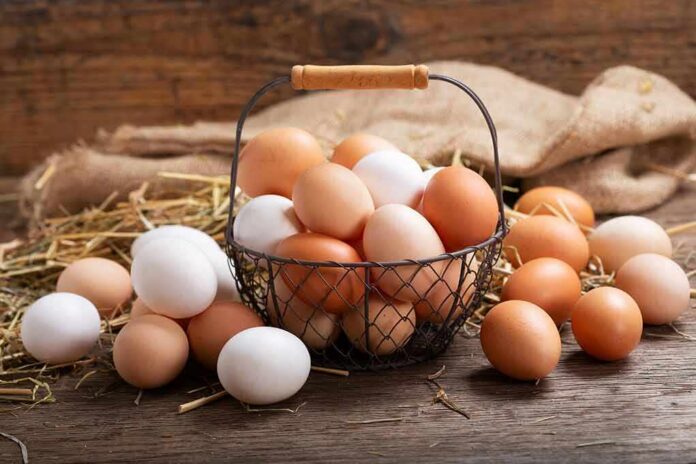 Basket of brown and white eggs on rustic wooden table
