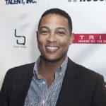 Lemon’s Holocaust Hedge Ignites Outrage smiling man at event backdrop