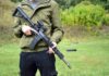 Gun Ban Crumbles — Supreme Showdown Next person holding a black rifle outdoors