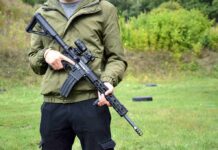Gun Ban Crumbles — Supreme Showdown Next person holding a black rifle outdoors