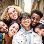 Assimilation Isn’t Dead — Numbers Stun Critics Group of friends smiling closely together outdoors