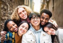 Assimilation Isn’t Dead — Numbers Stun Critics Group of friends smiling closely together outdoors