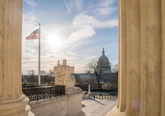 Washington,,Dc,,Us-february,6,,2023:,View,Of,The,Us,Capitol White building with columns under a blue sky.