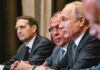 Group of government officials engaged in a serious discussion during a meeting