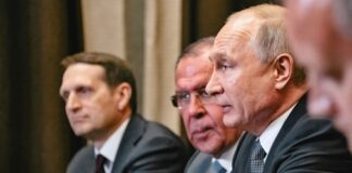 Group of government officials engaged in a serious discussion during a meeting