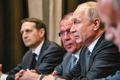 Sochi,,Russia,-,May,14,2019:,Vladimir,Putin,With,Members Group of government officials engaged in a serious discussion during a meeting