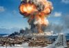 A nuclear explosion with a military aircraft in the foreground