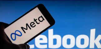 Meta logo on phone, Facebook logo in background.