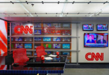 CNN World Headquarters studio with empty red chairs.