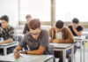 Students taking a test in a classroom.