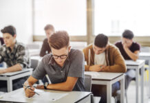 Students taking a test in a classroom.