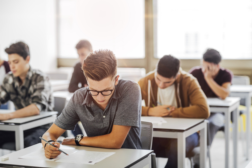 Students taking a test in a classroom.